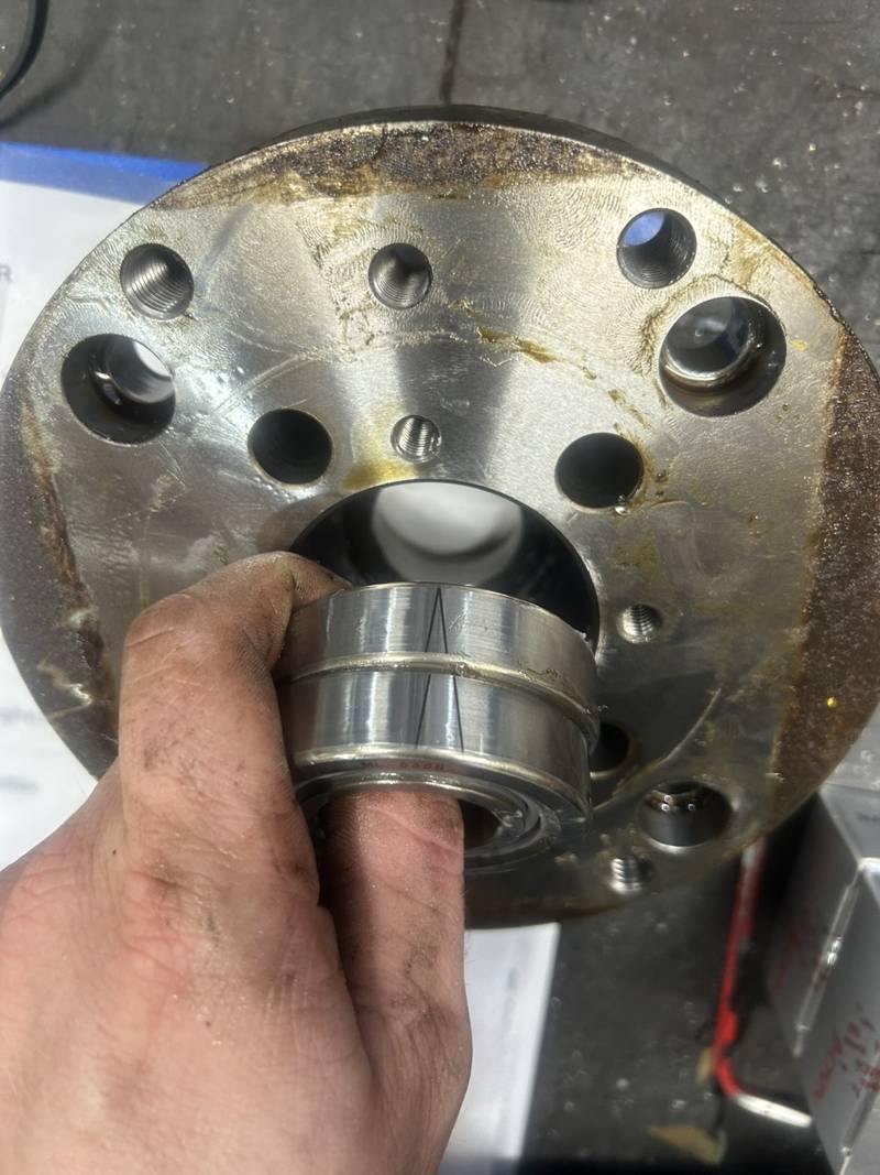 Matched pair of bearings held up to a spindle housing