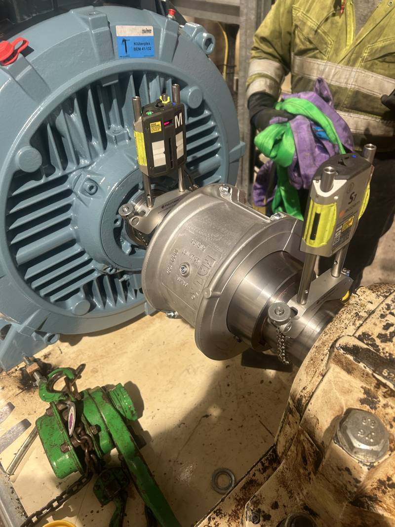 Laser alignment heads fitted across a motor and gearbox coupling