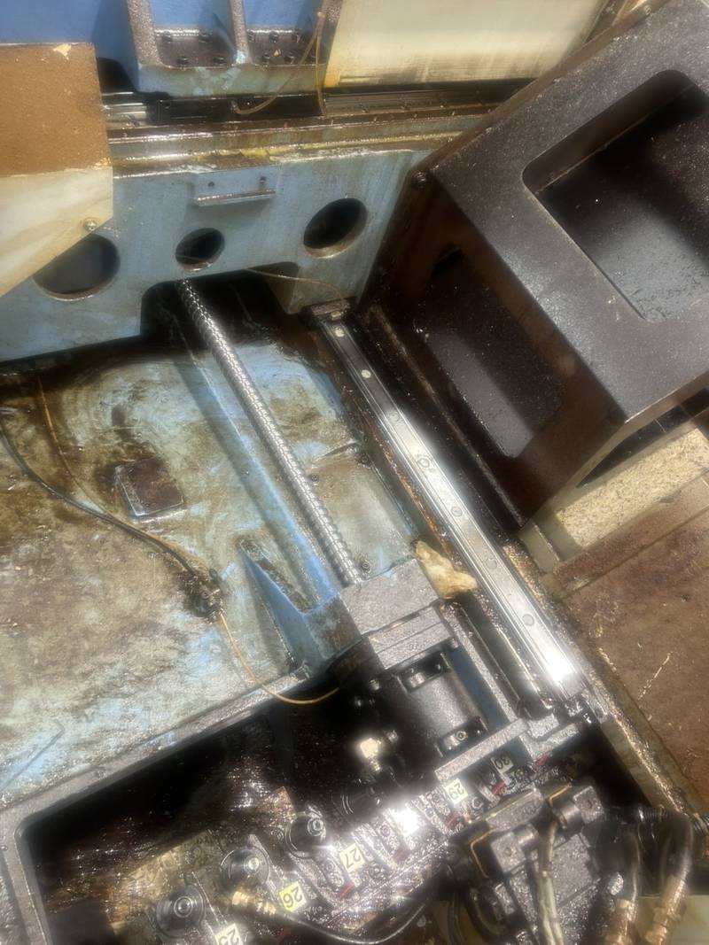 Machine bed with ballscrew and linear guide rail exposed