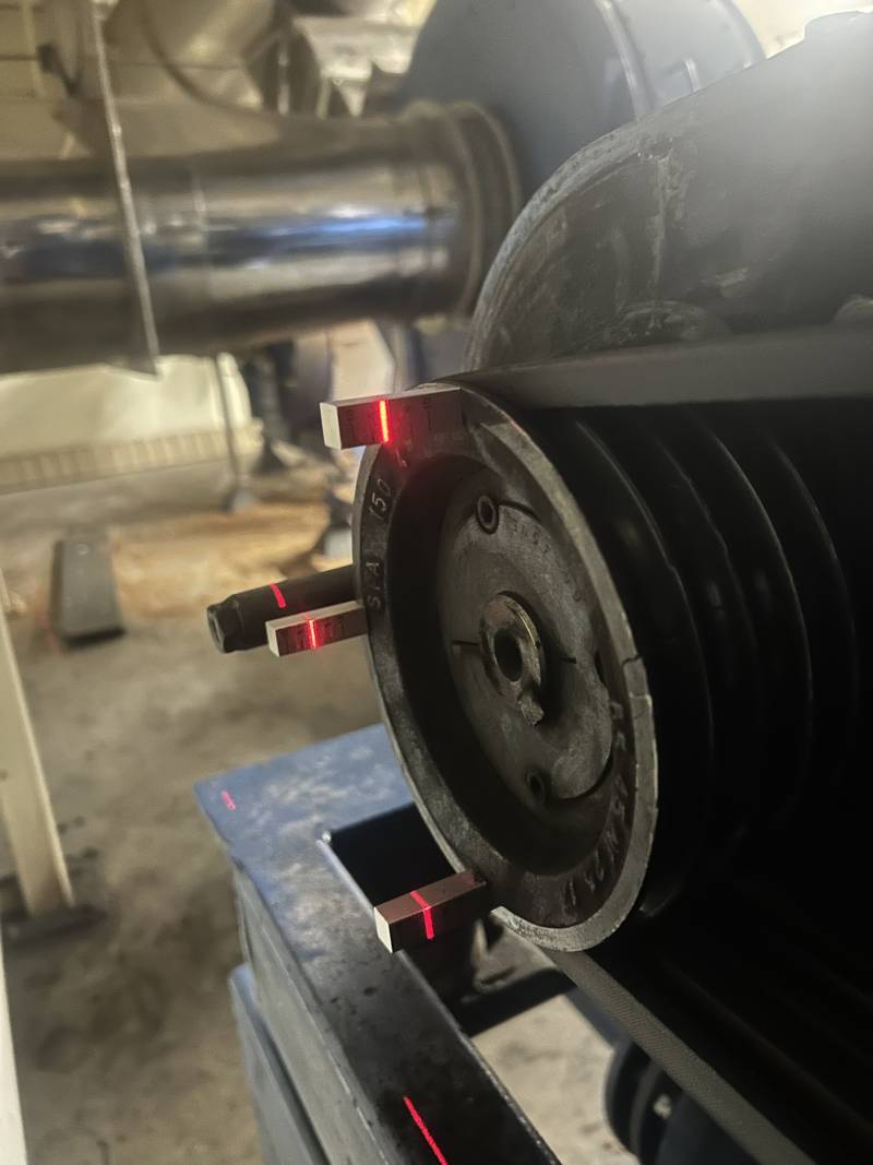 Laser pulley alignment tool on a V-belt pulley